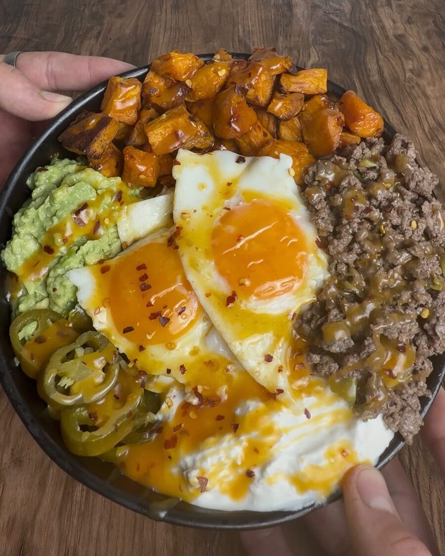 Hot Honey Beef and Eggs Bowl — roasted sweet potato, runny eggs, ground beef, avocado, jalapeños and a hot honey drizzle